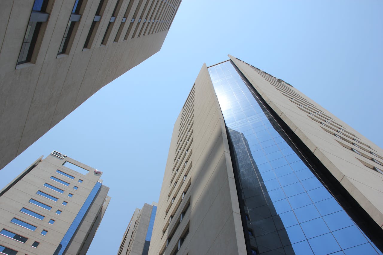 creative-02 Dynamic low angle view of Asunción's skyscrapers under a bright blue sky, showcasing modern architecture.